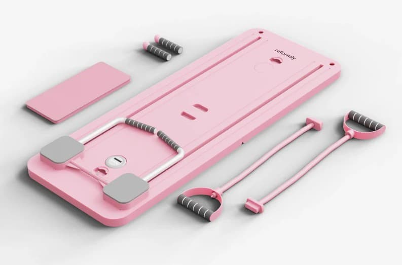 The Pilatease Board kit: platform, handlebar, resistance bands, and accessories.